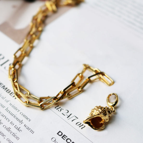 Gold Biography Shell Charm