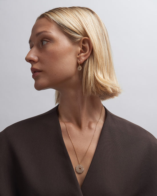 Solid Gold Rising Sun Huggie Earrings