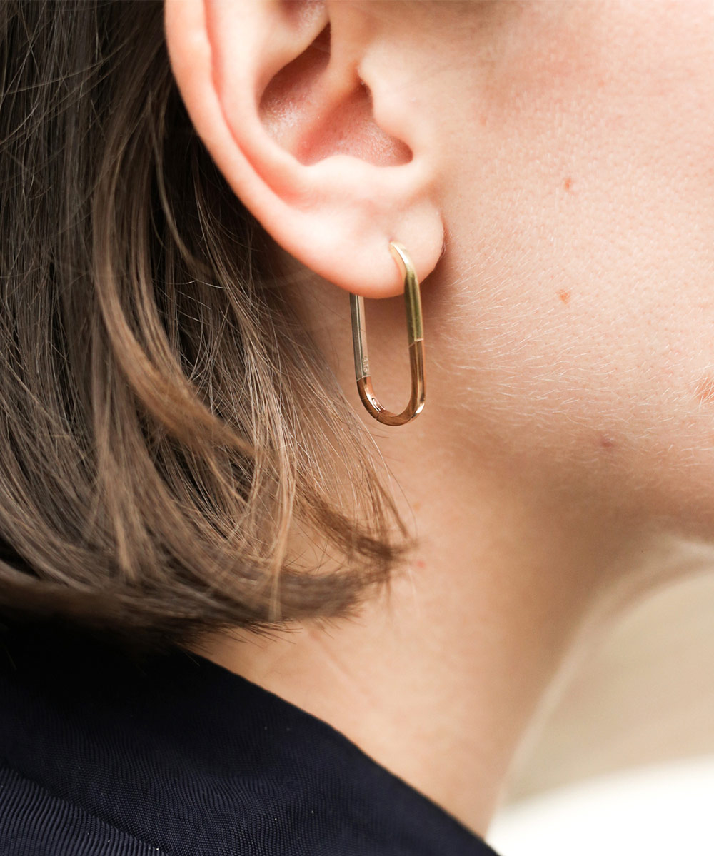 Model wearing a mixed metal oval hoop earring from Astley Clarke | The Astley Clarke Blog