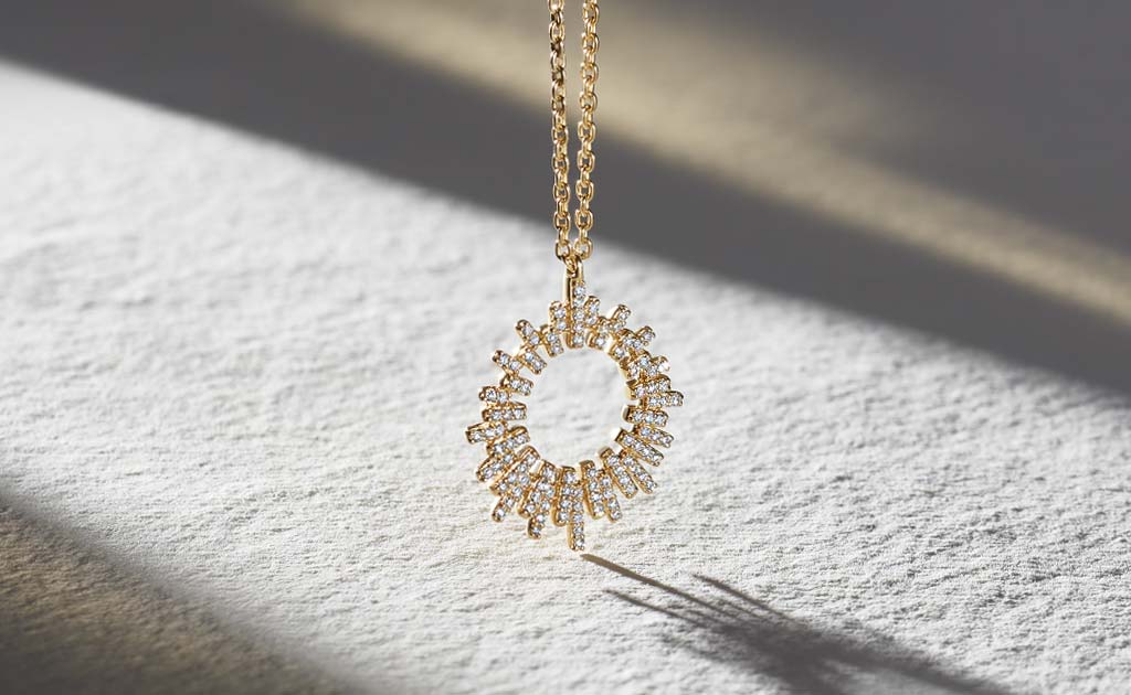 14 carat solid gold diamond Comet burst pendant necklace by British jewellery designer Astley Clarke