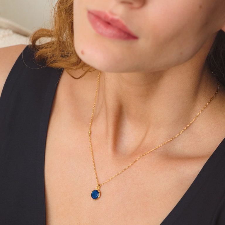 dainty gold necklace with lapis gemstone pendant