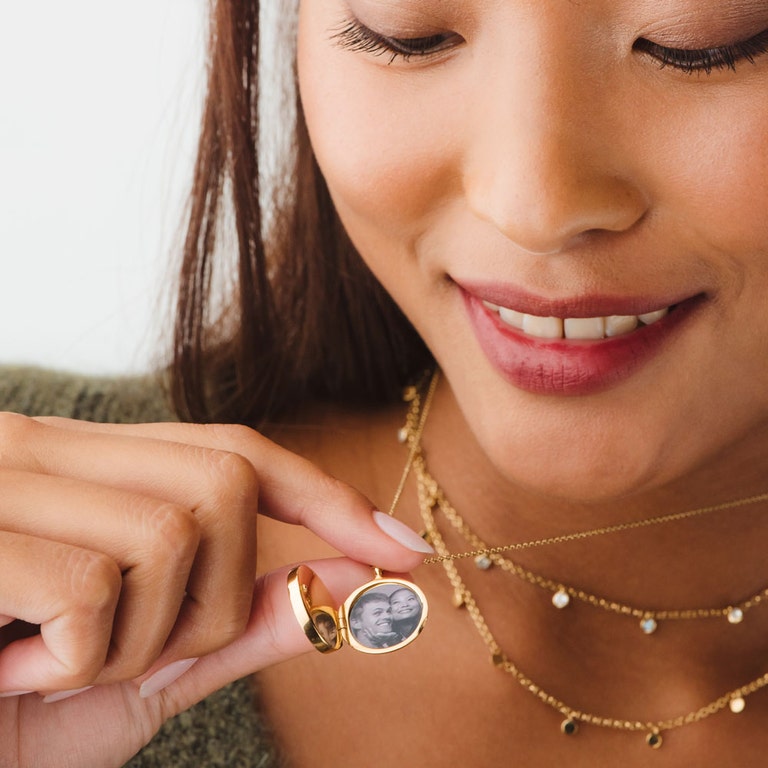 gold photo locket necklace with gold droplet necklace