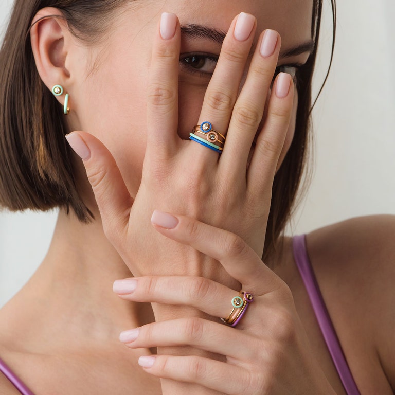 enamel stacking rings with green huggie earring