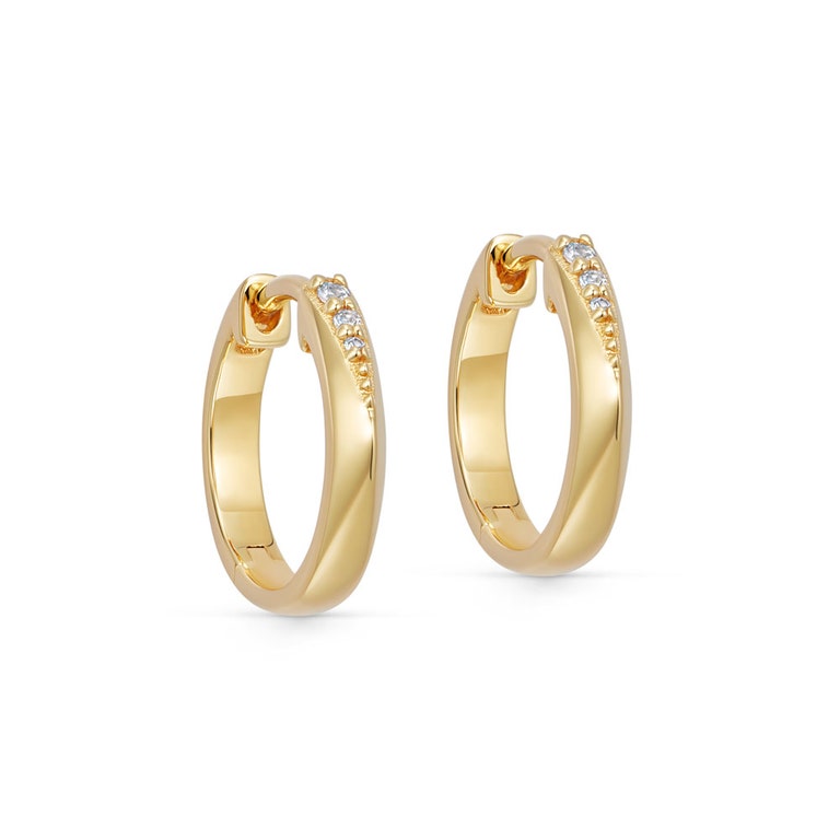 Discover elegance in every detail with our Gold Deco Shard Huggie Hoop Earrings. Elevate your style effortlessly. Shop now for timeless sophistication!
