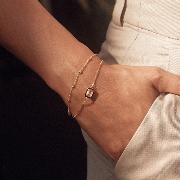 Gold Flare White Topaz Emerald Cut Bracelet
