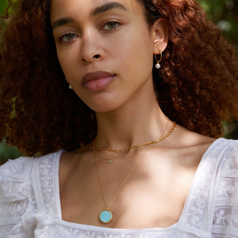 Gold Stilla Amazonite Locket Necklace  with gold evil eye necklace and pearl drop hoop earrings