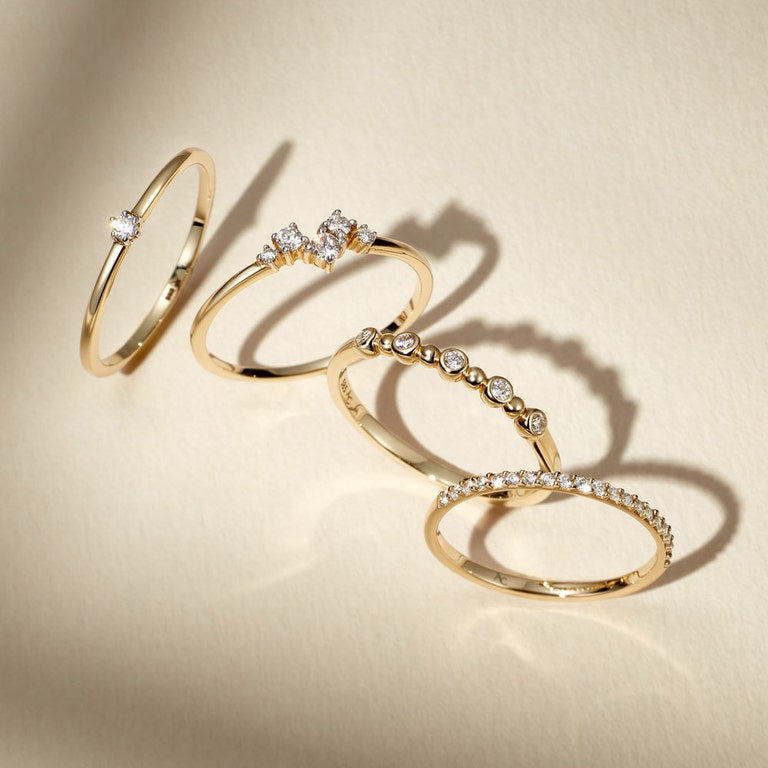still life image of stacking sold gold diamond rings 
