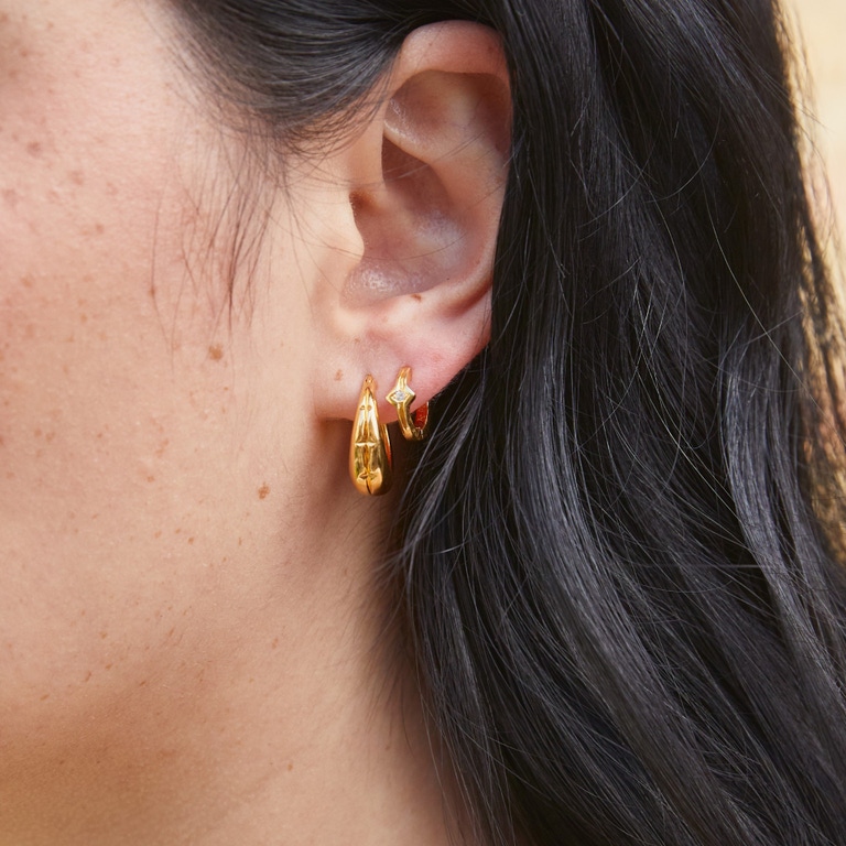 Gold Luna Star Huggie Hoops | Astley Clarke