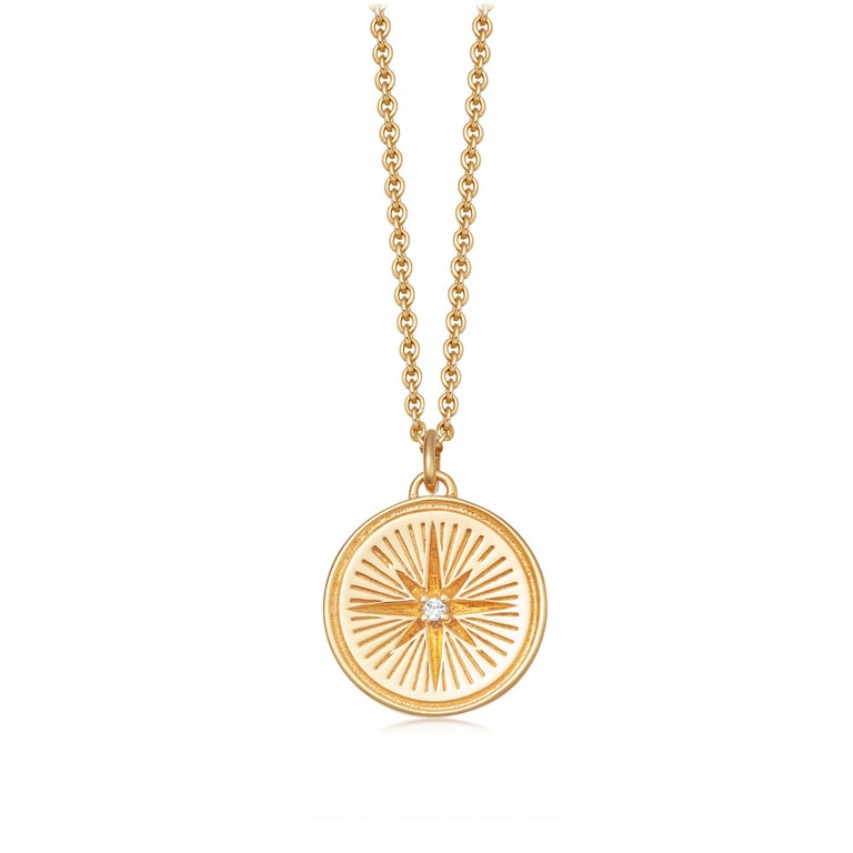 Golden pendant with compass motif