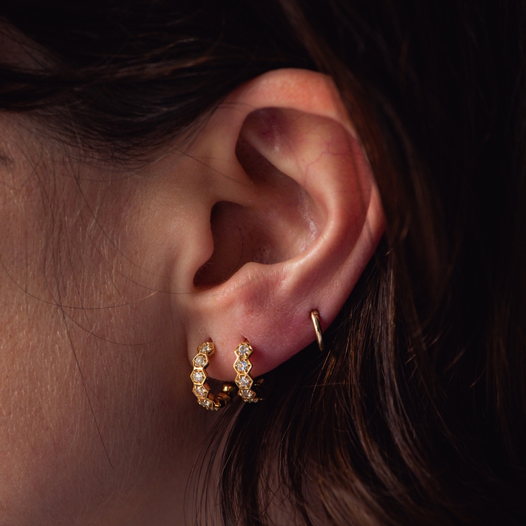 huggie sapphire hoop earring and 14ct yellow gold hoop earring