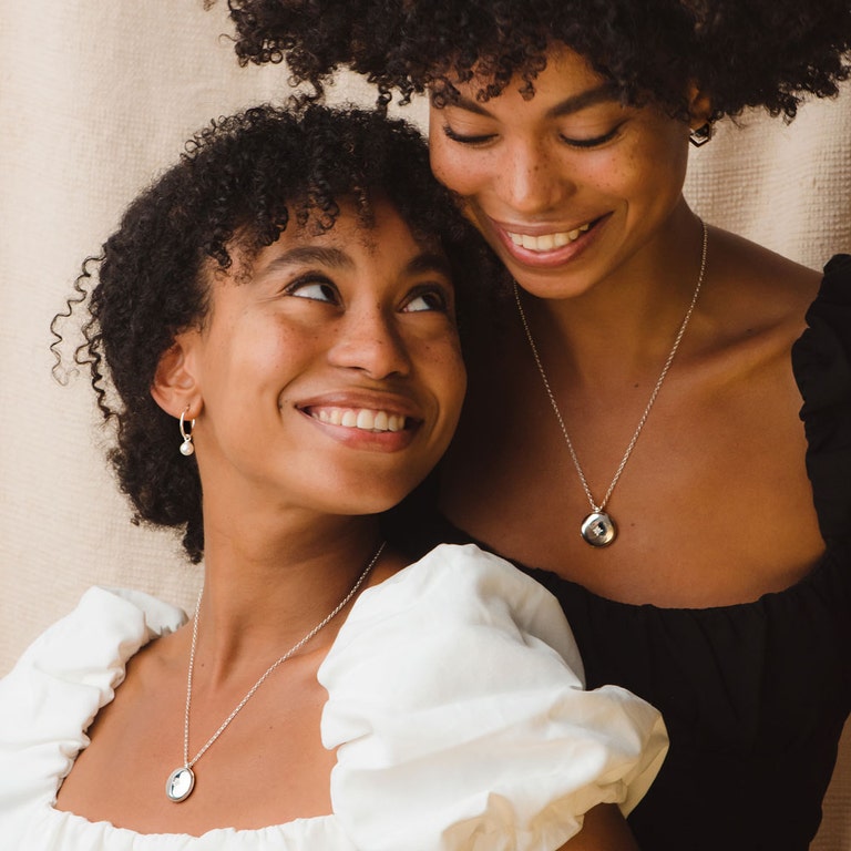 silver pearl drop earrings with silver locket necklace