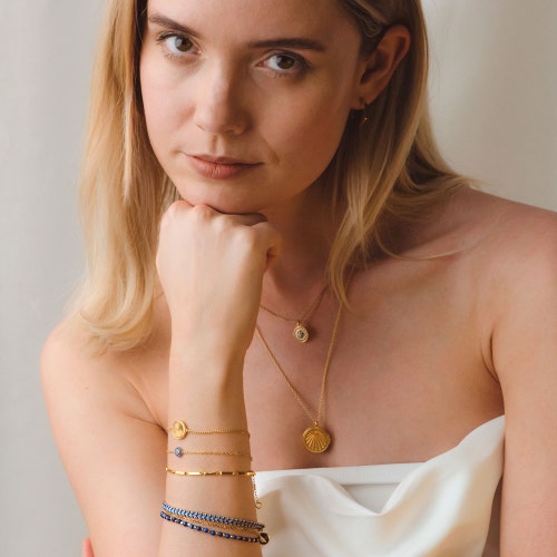 Gold Biography Lapis Charm Bracelet