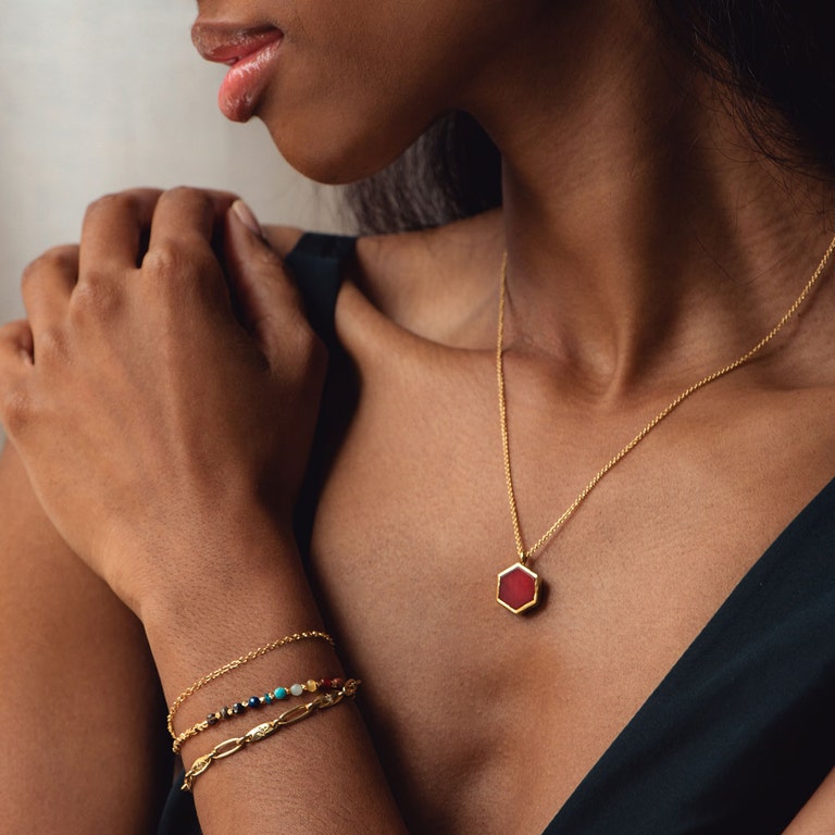 red agate locket necklace and rainbow gold bracelet stack