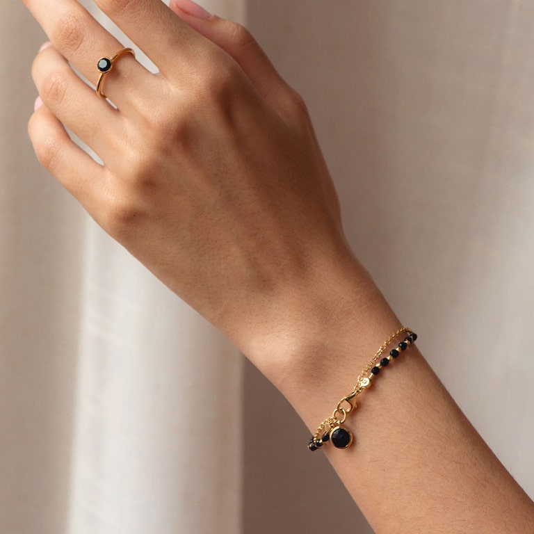 Gold Biography Black Onyx Charm Bracelet