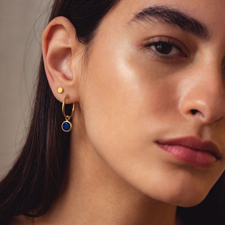 gold plain earring disc with hoop with blue gemstone