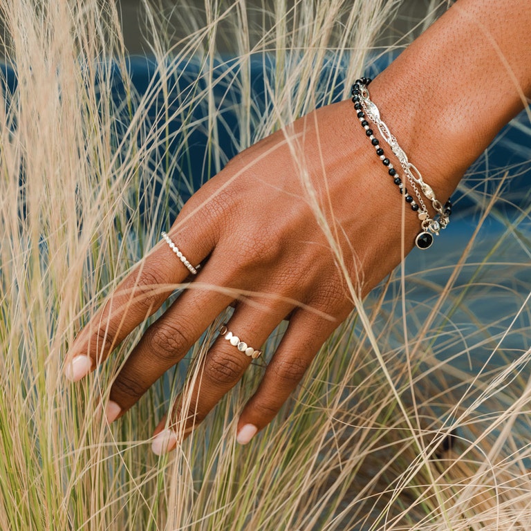 silver jewellery stack with silver bracelets and sterling silver stacking rings