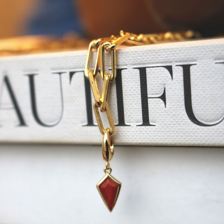 Gold Biography Red Agate Kite Charm