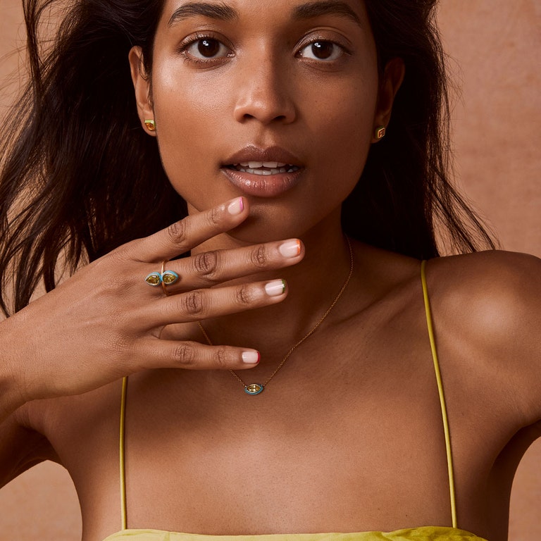 peridot cocktail ring, gold stud earrings and gemstone pendant necklace