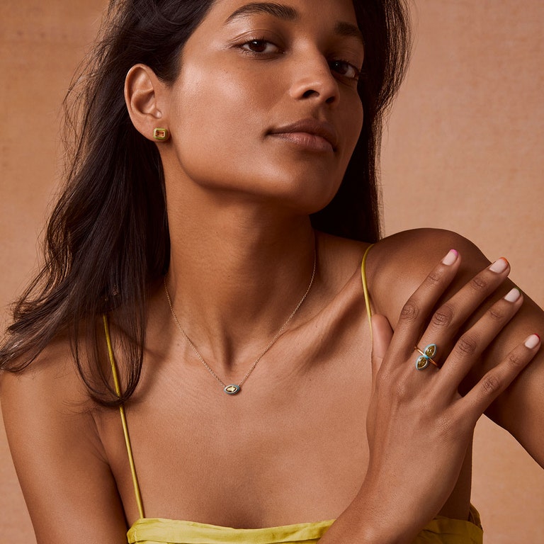 neon enamel jewellery with green stud earrings, blue statement cocktail ring and yellow pendant necklace with blue enamel