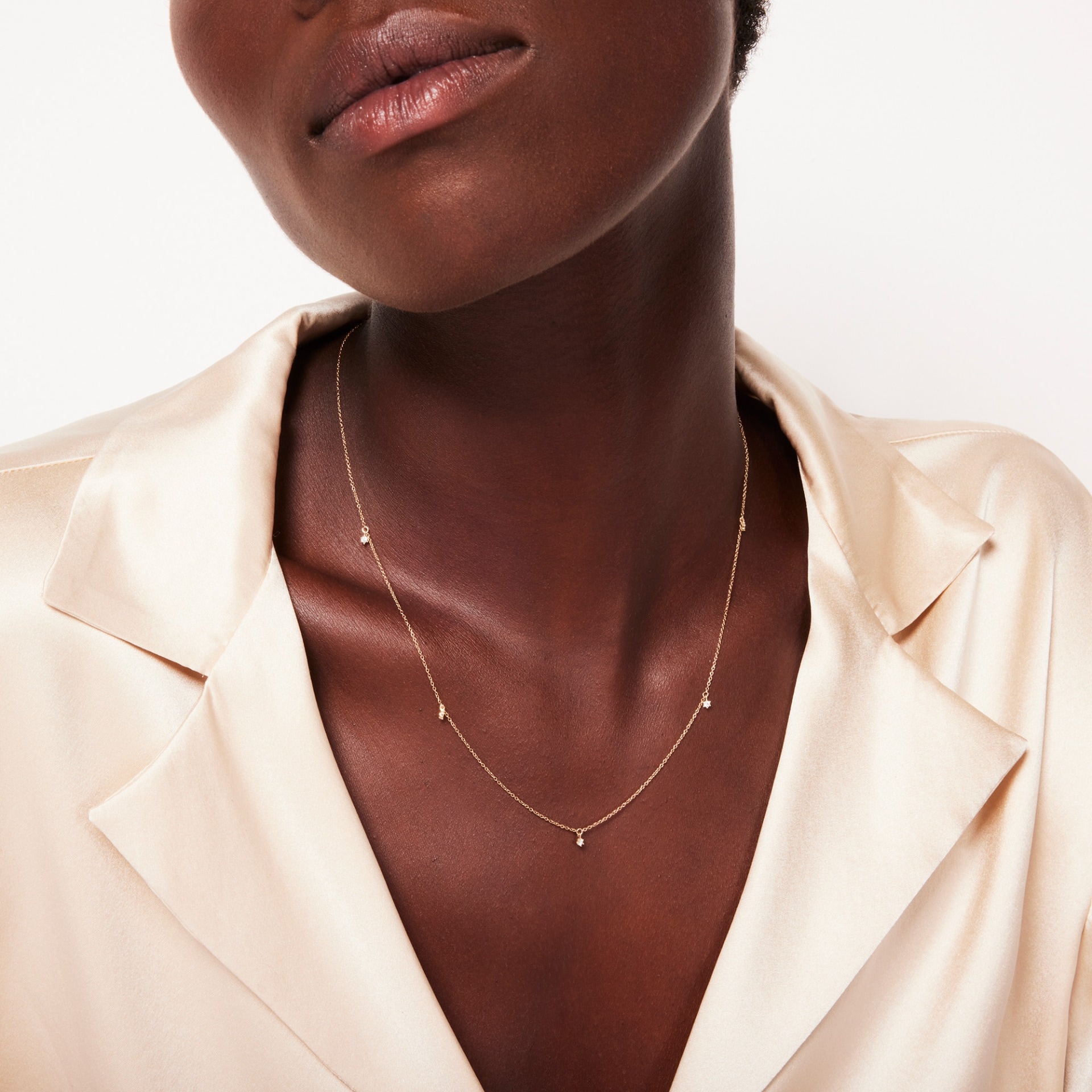 Gold and diamond station necklace top