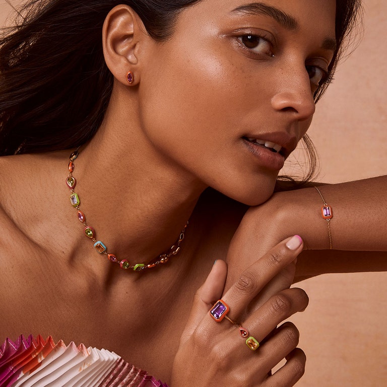 colourful jewellery with purple stud earrings, amethyst cocktail ring, neon orange bracelet and multicoloured enamel choker necklace