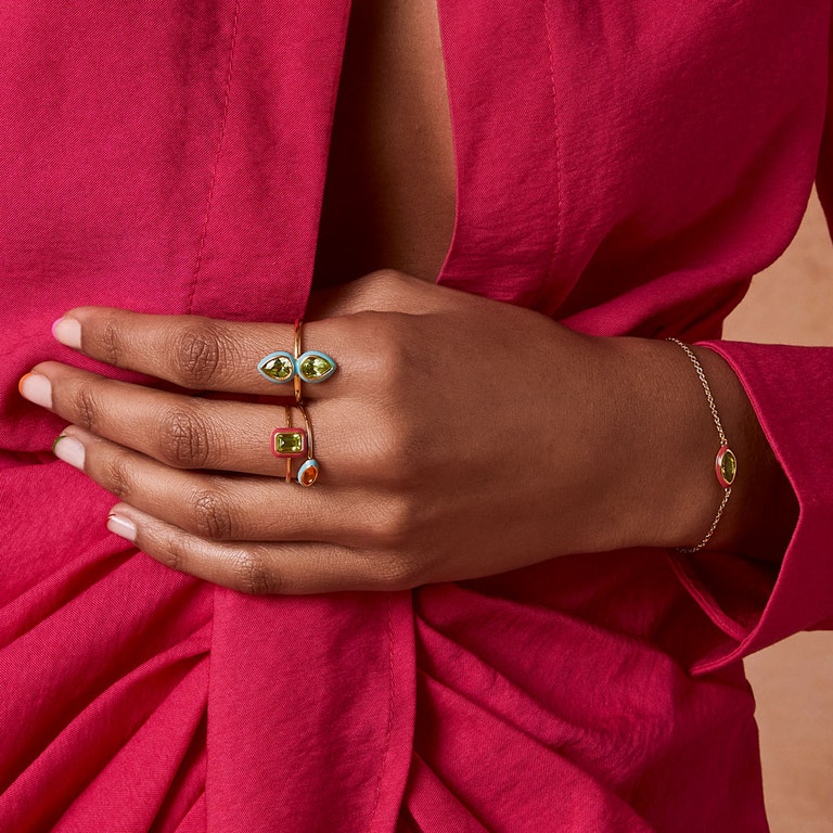 gold statement ring with yellow gemstone and neon enamel