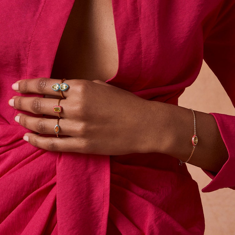 gold jewellery collection with gold chain gemstone bracelet and colourful gold stacking rings