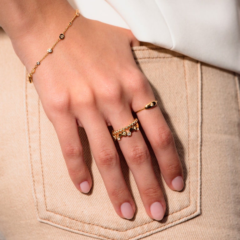 gold ring stack with white sapphires and dainty gold station necklace