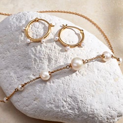 gold pearl necklace and pearl hoop earrings