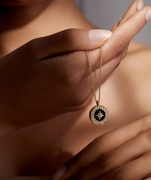 Still life of celestial jewellery pieces