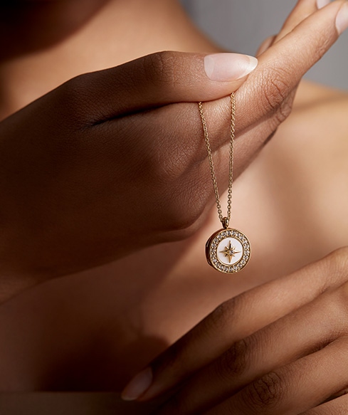 Still life of celestial jewellery pieces