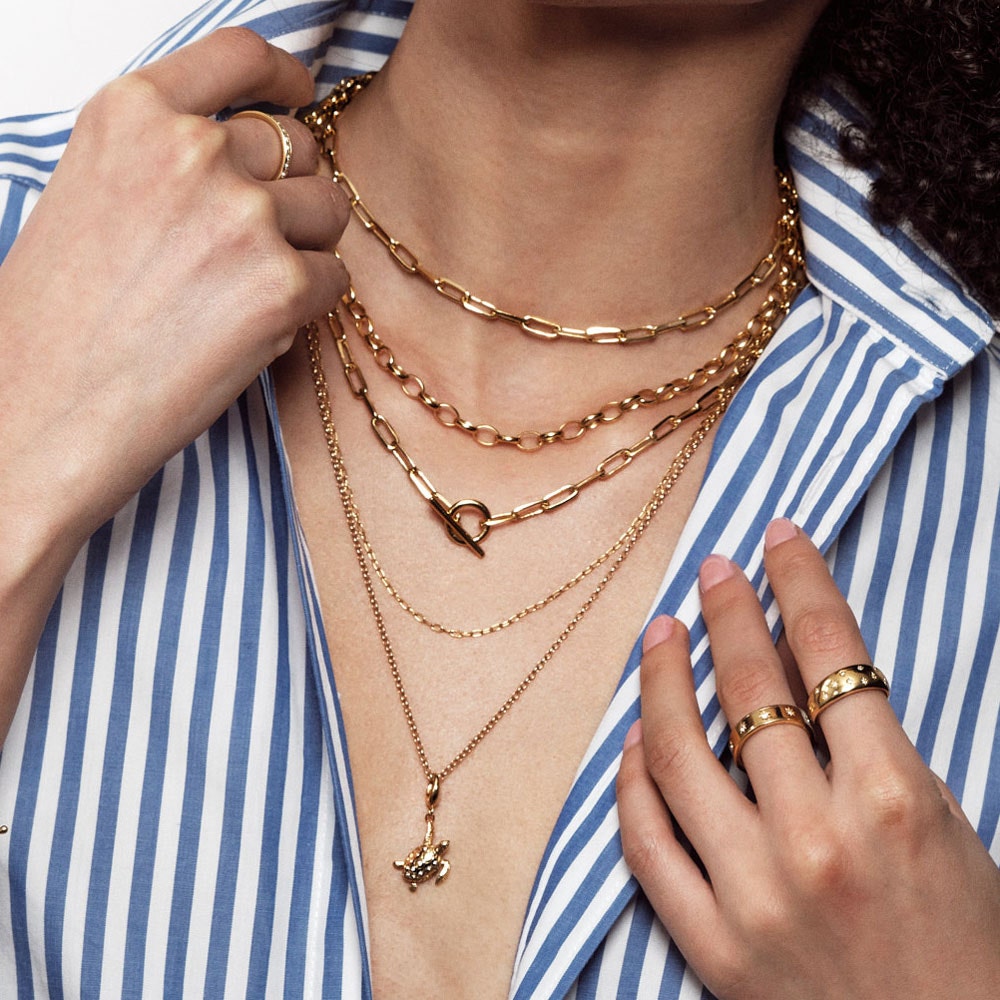 gold necklace stack with t bar necklace