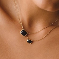 gold and black onyx necklace stack