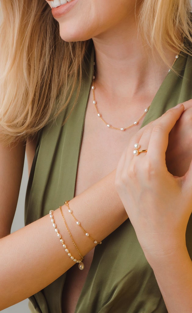 seed pearl bracelet stack in yellow gold