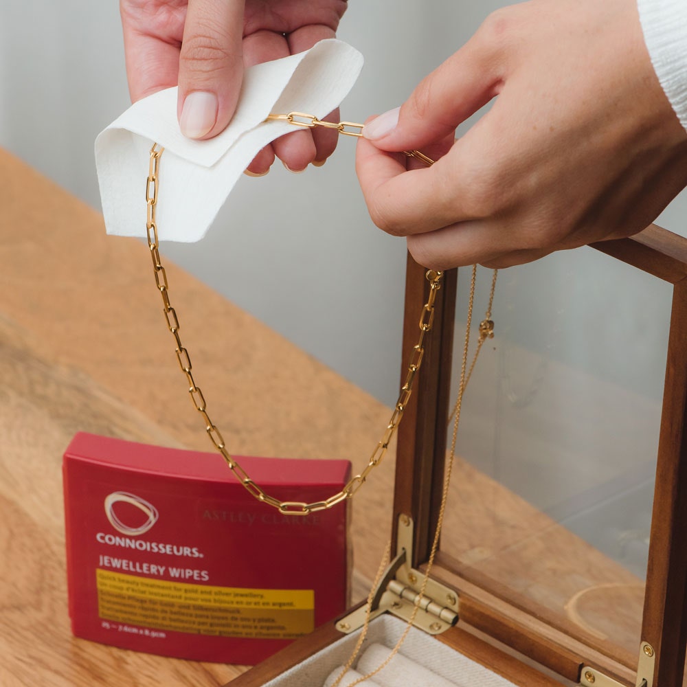 Gold chain necklace being cleaned