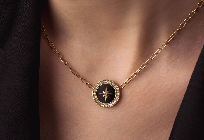 gold station necklace with black onyx gemstone