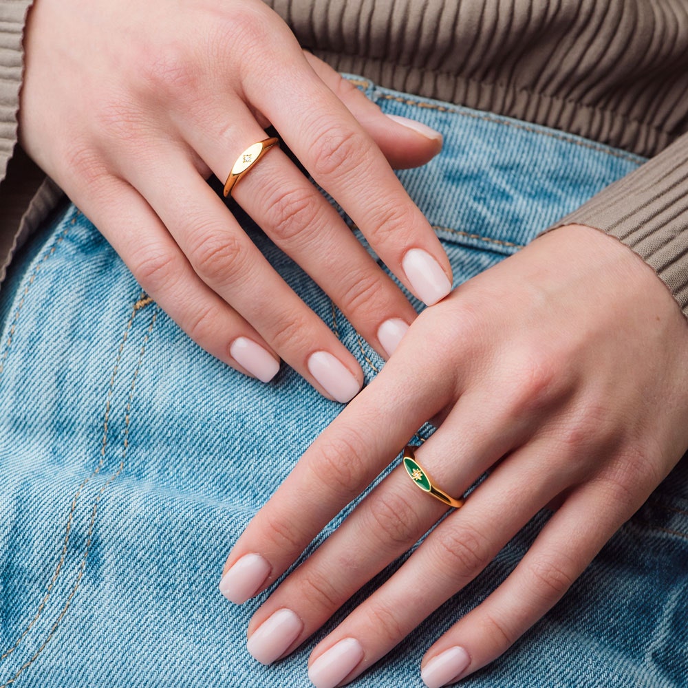 gold signet ring and green enamel signet ring