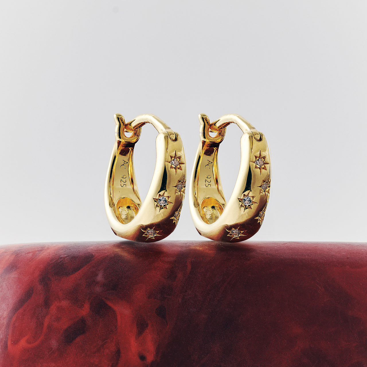 Still life of celestial jewellery pieces