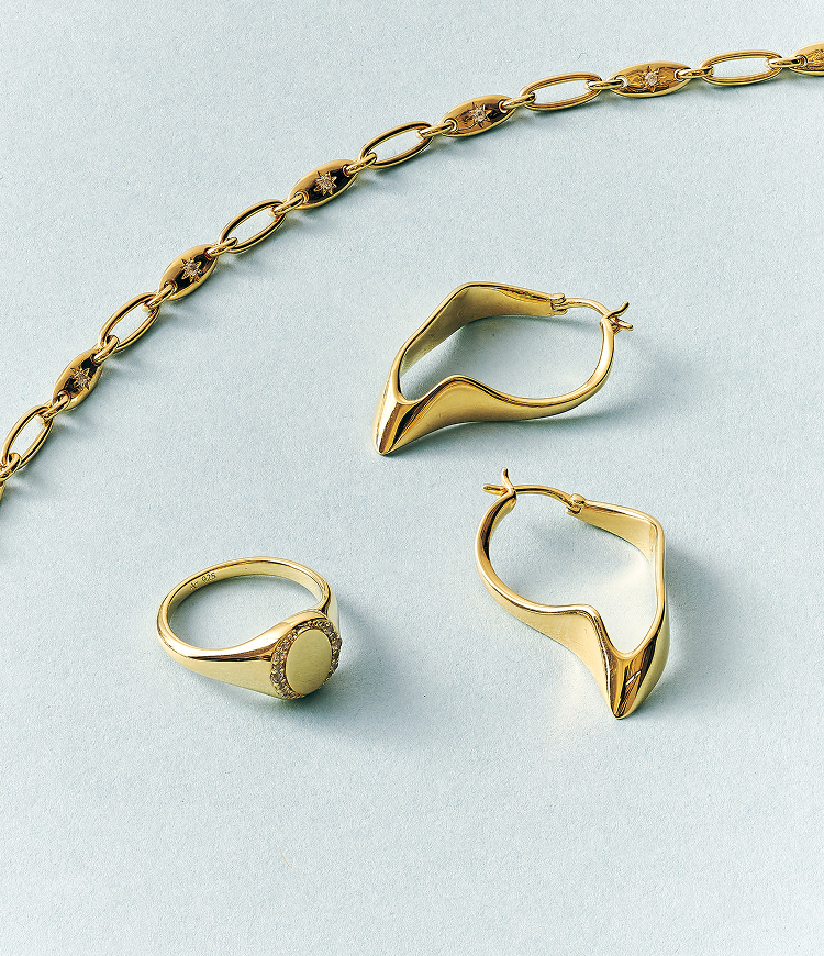 Still life of celestial jewellery pieces