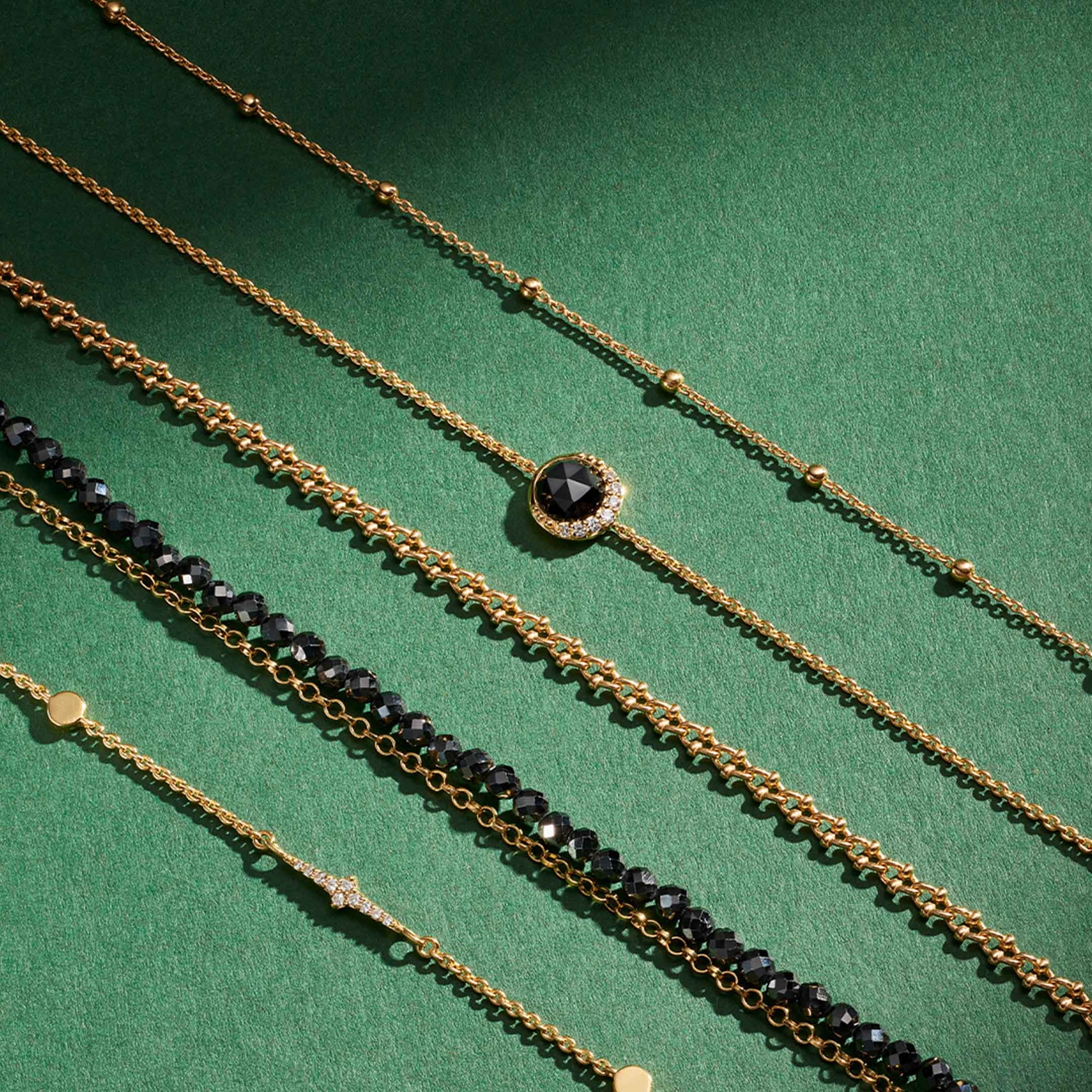 Still life of celestial jewellery pieces