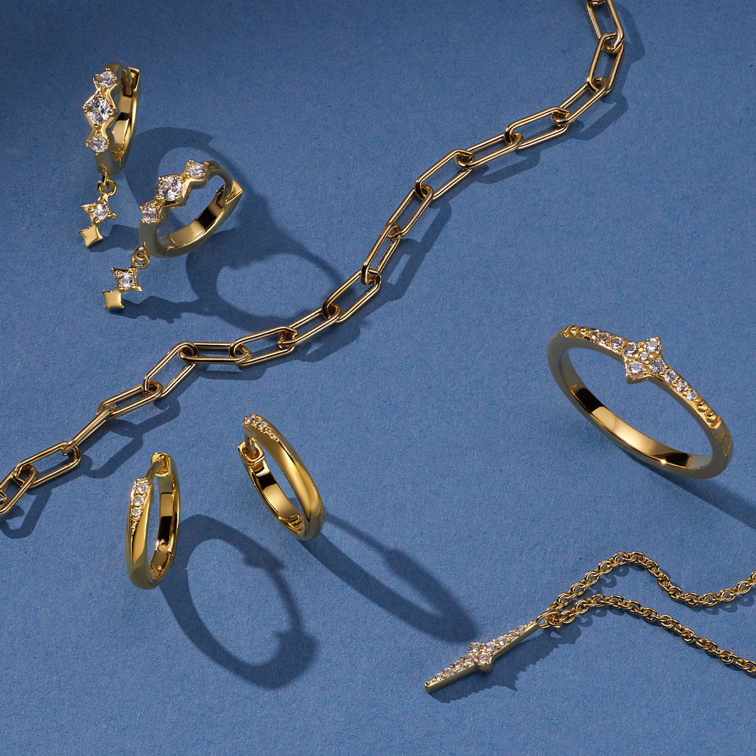 Still life of celestial jewellery pieces