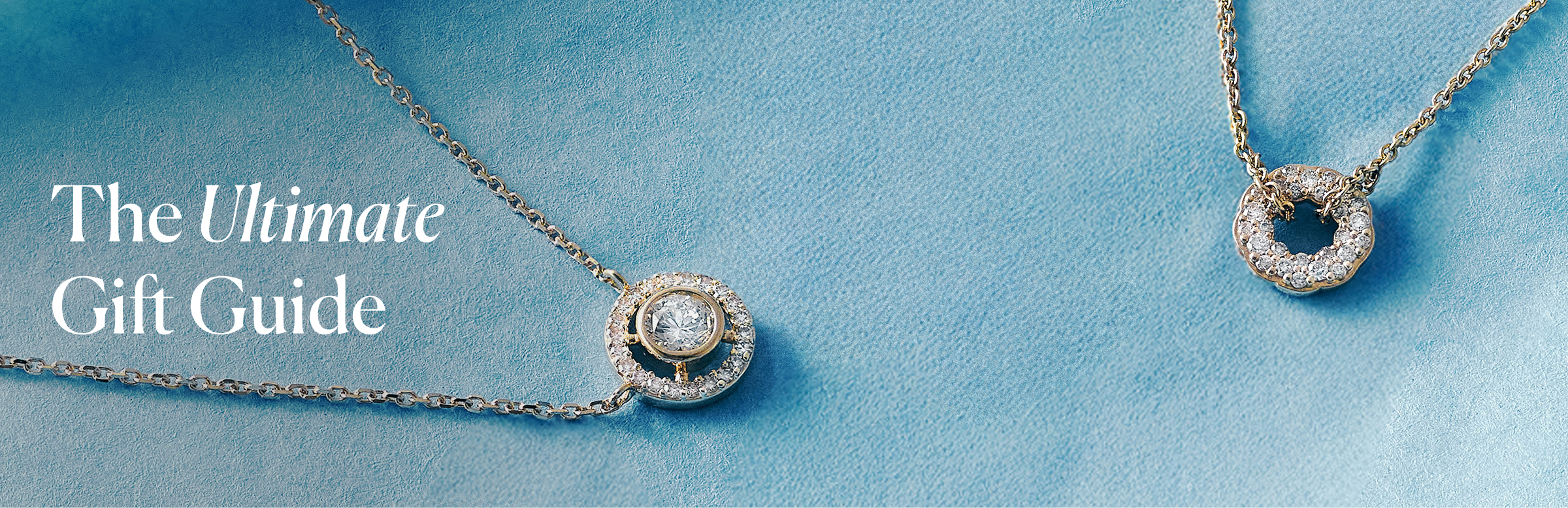 Gold jewellery stack with engraved locket