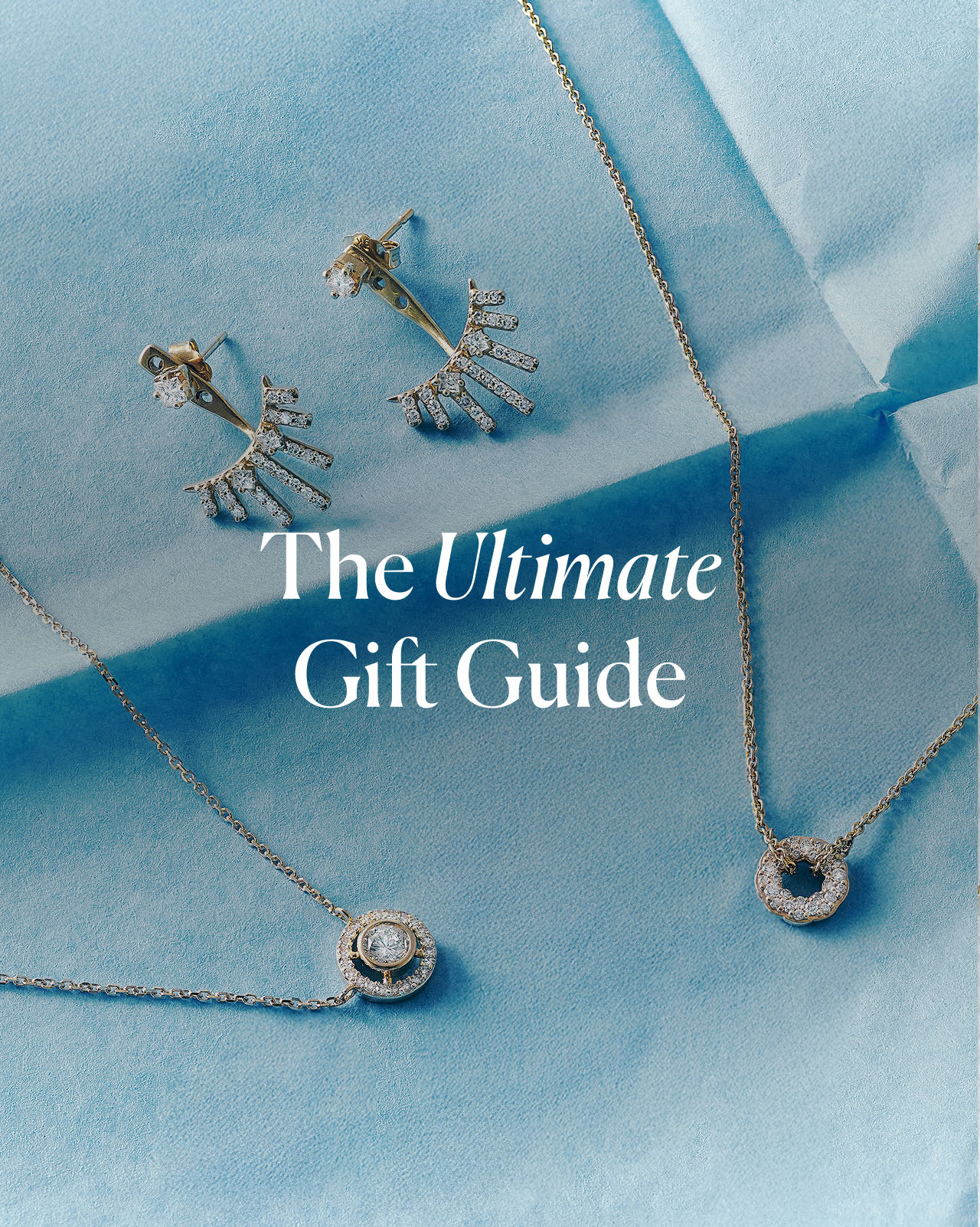 Gold jewellery stack with engraved locket