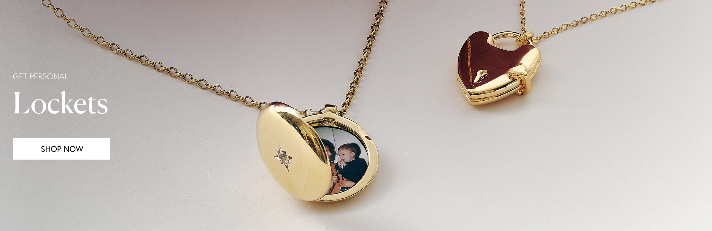 Gold jewellery stack with engraved locket