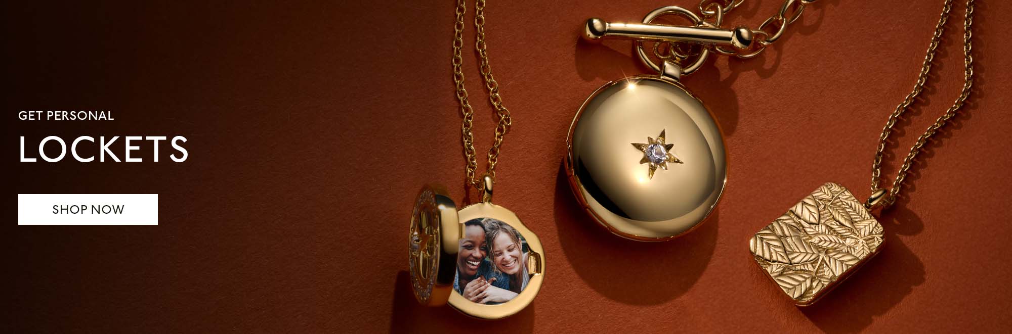 Gold jewellery stack with engraved locket