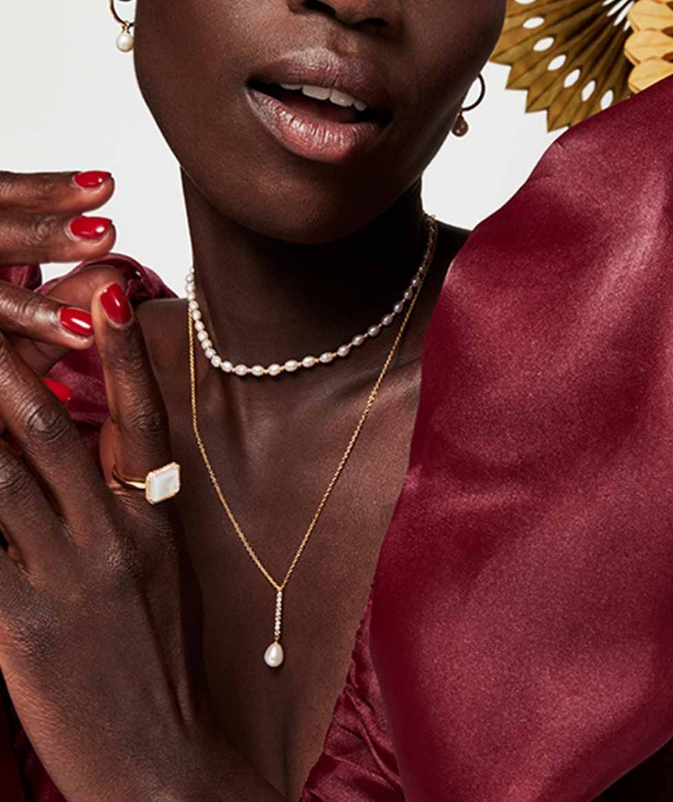 Still life of celestial jewellery pieces
