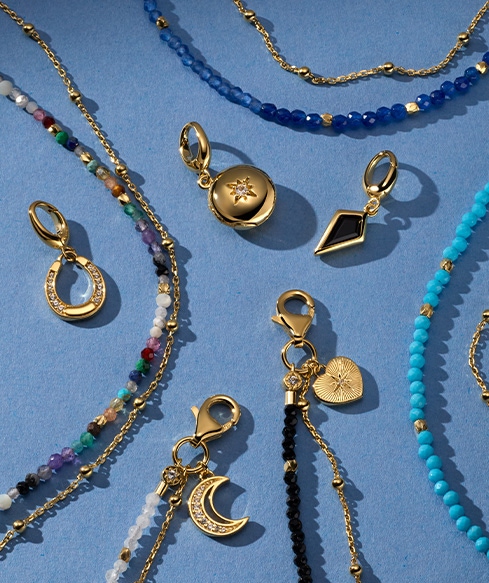 Still life of celestial jewellery pieces