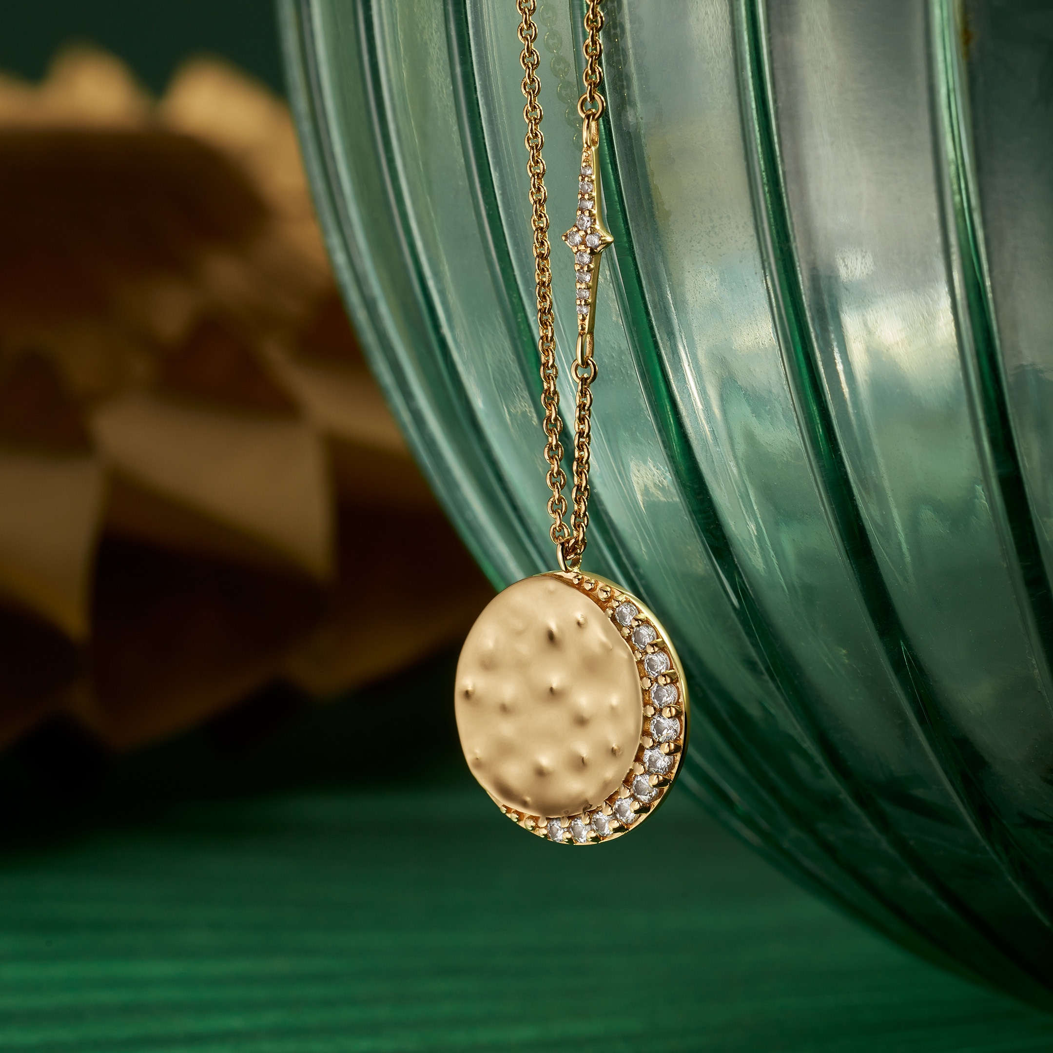 Still life of celestial jewellery pieces