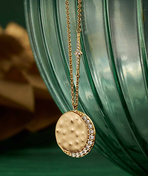 Still life of celestial jewellery pieces